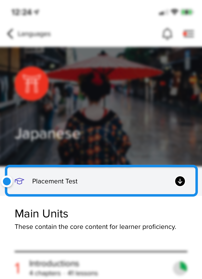 A blue box where to tap on the screen to download the placement test.